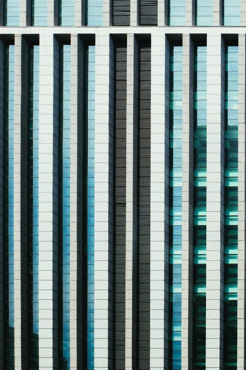 Symmetrical modern high-rise building symbolizing organizational structure and systems architecture.